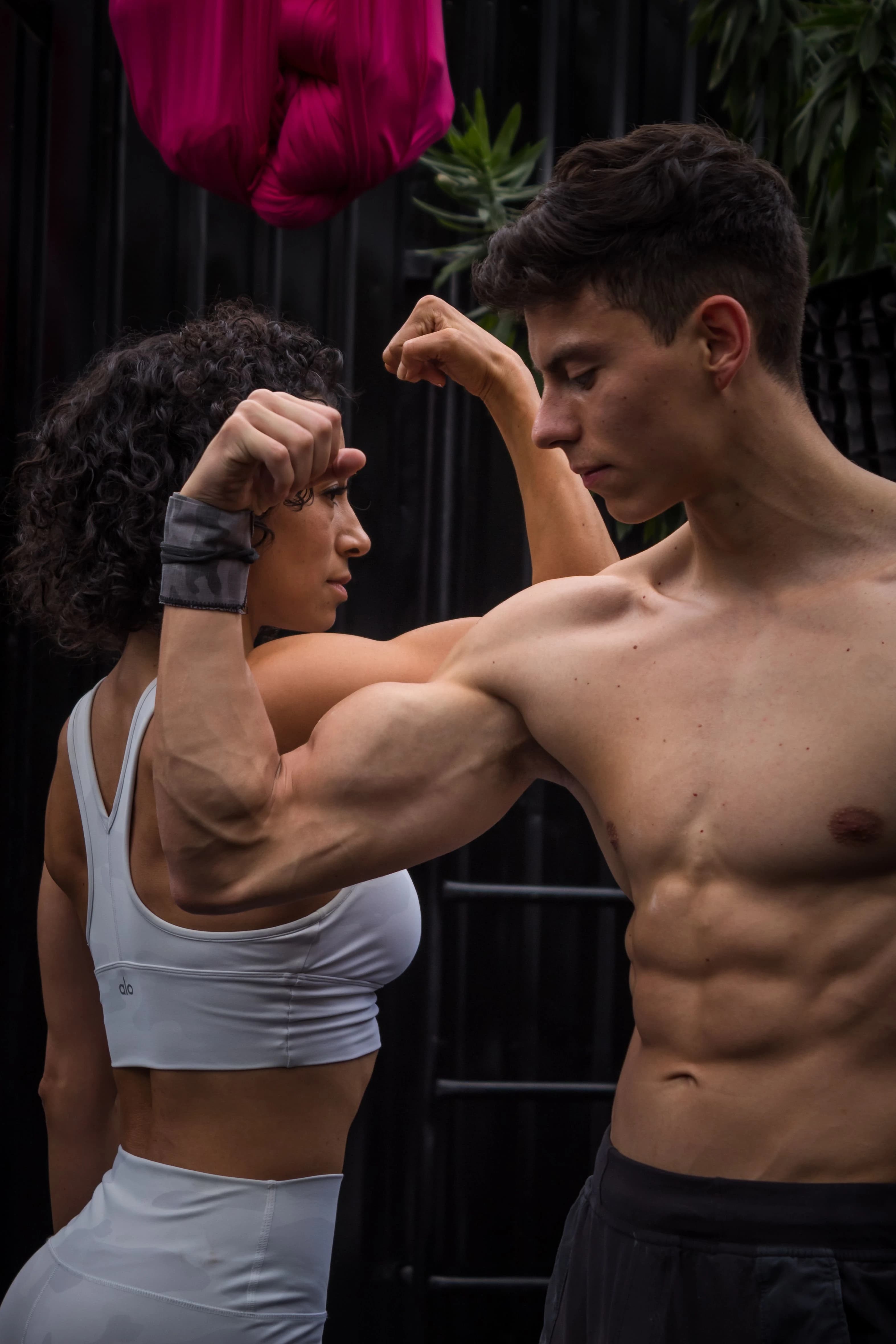 Two athletes in a strength pose
